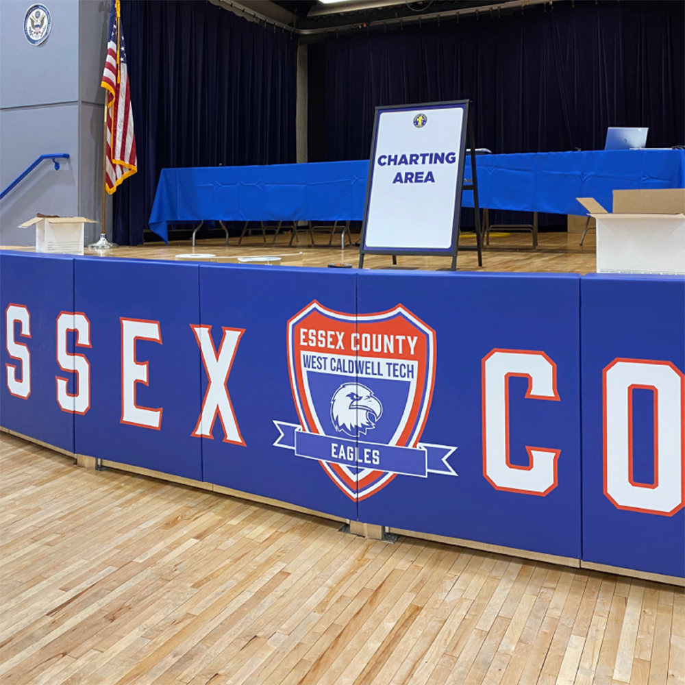 fixed stage wall pads in blue with school logo