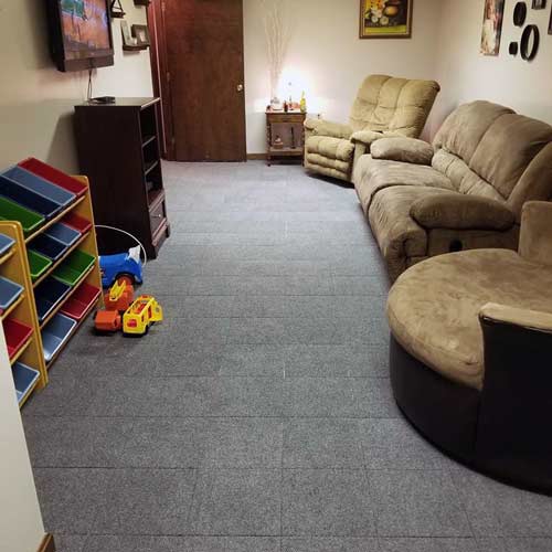 gray Carpet Tiles installed in basement family room