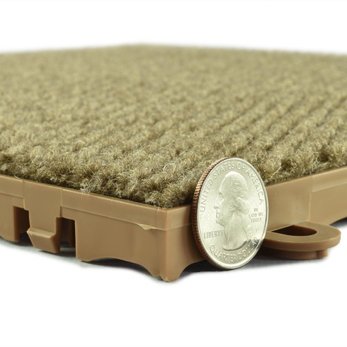 Snap Together  Raised Carpet Tile Squares image showing thickness with quarter for reference 