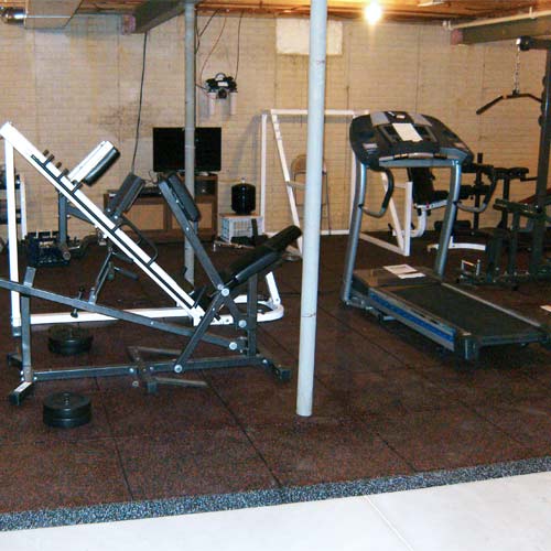 UltraTile Rubber Weight Room Floor with red flecks installed in basement home gym