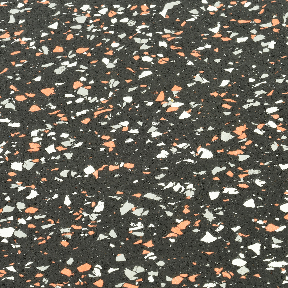 close up of rubber flooring with orange and gray color speacks
