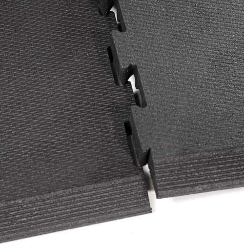 Waffle fatigue rubber flooring showing interlocking design.