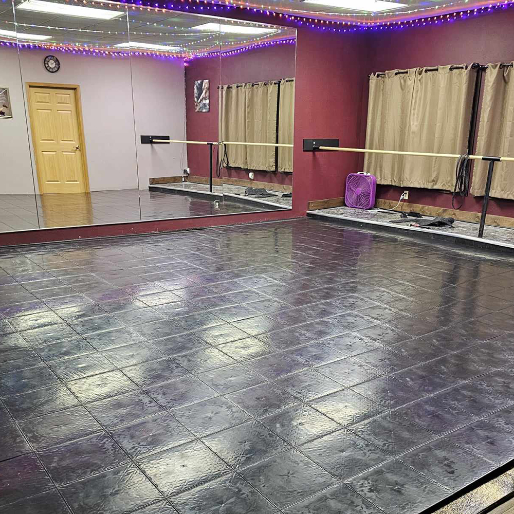 black flat top interlocking tiles used for dance studio floor