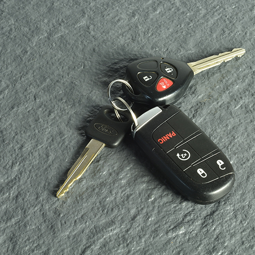 close up of gray supratile slate with car keys
