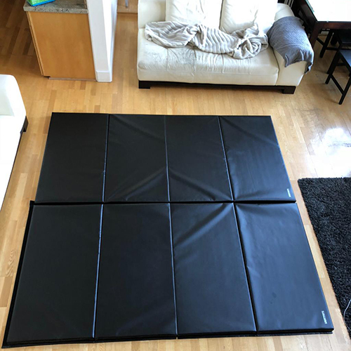 Black 4x8x2 Folding Gym Mats in Living Room