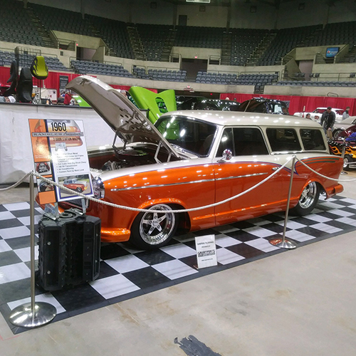 Garage Floor Tiles Under Rambler Wagon at indoor car show