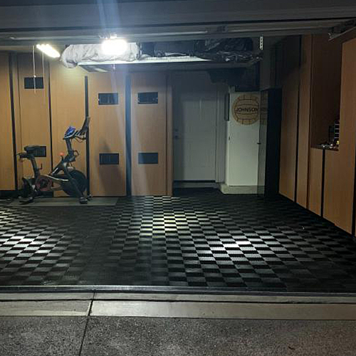 full garage installation of Perforated Interlocking Garage Floor Tiles in black