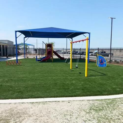 playground and playground turf with shade structure over the top