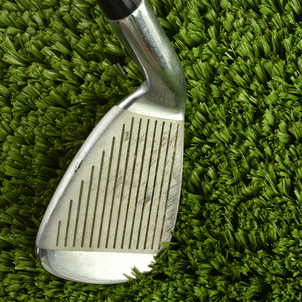 Chipper's Choice Artificial Turf Roll with 7 iron golf club
