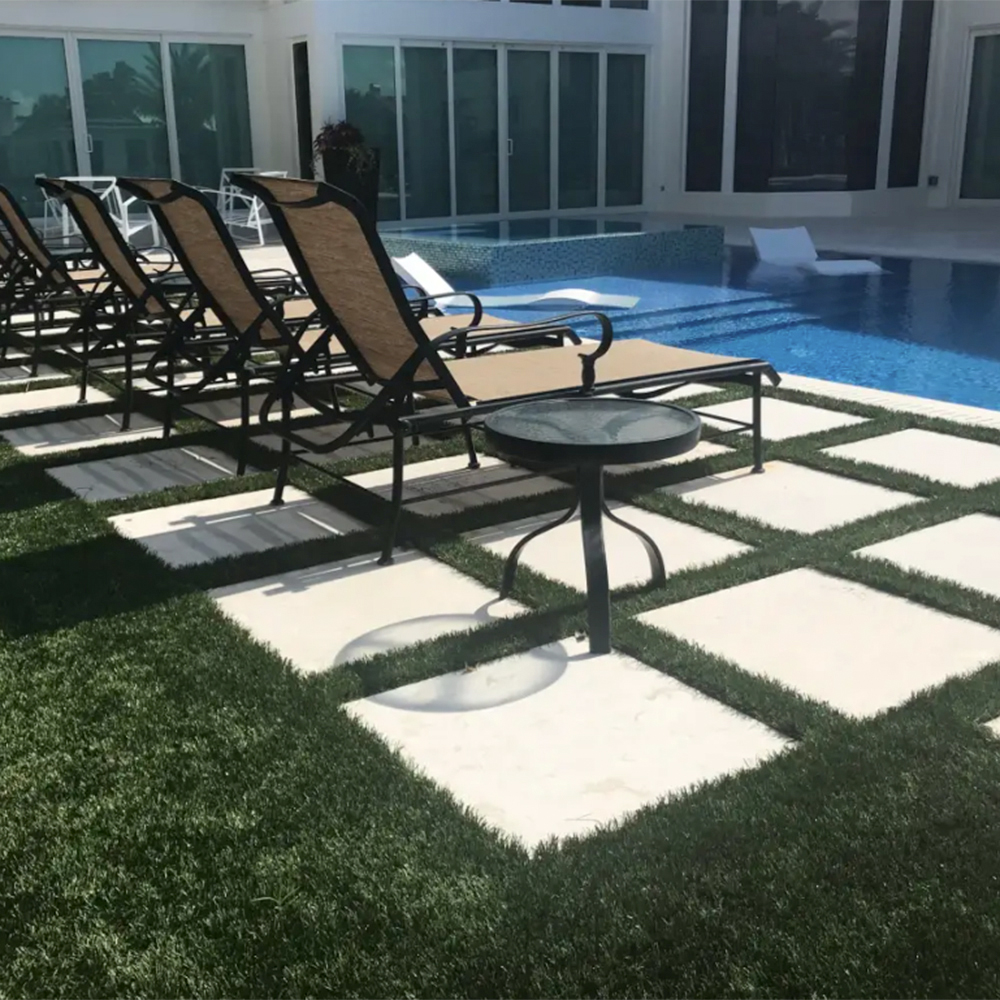 endless summer landscaping turf on poolside with concrete pavers