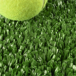 close up of green artificial turf for tennis with tennis ball
