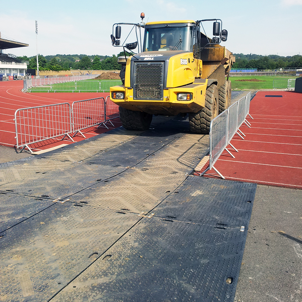 liberty ground protection mats over sports track at stadium