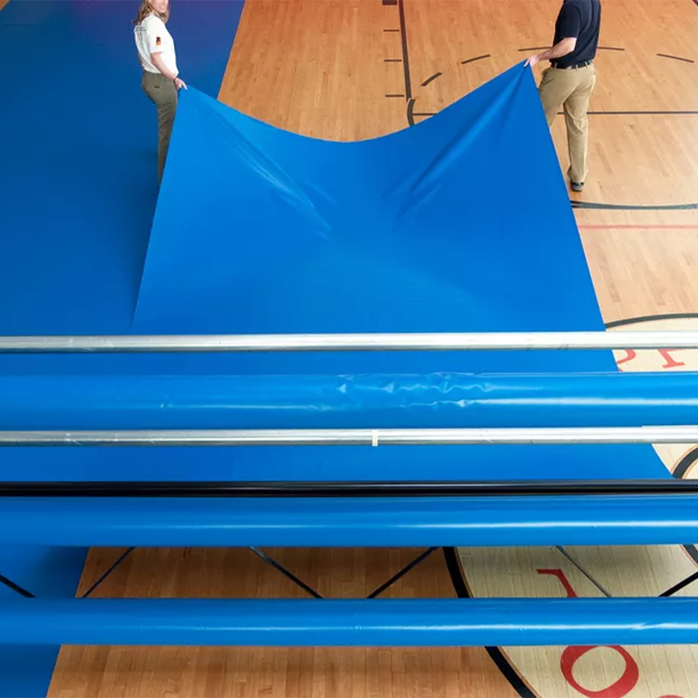 installation of vinyl gym floor cover in gymnasium