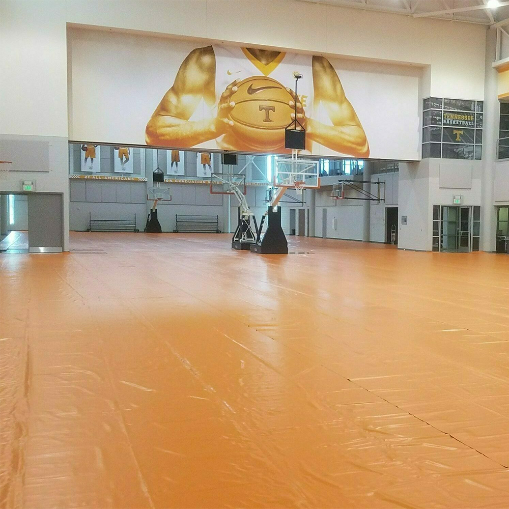 tan Gym Floor Cover 27 oz installed in empty gymnasium