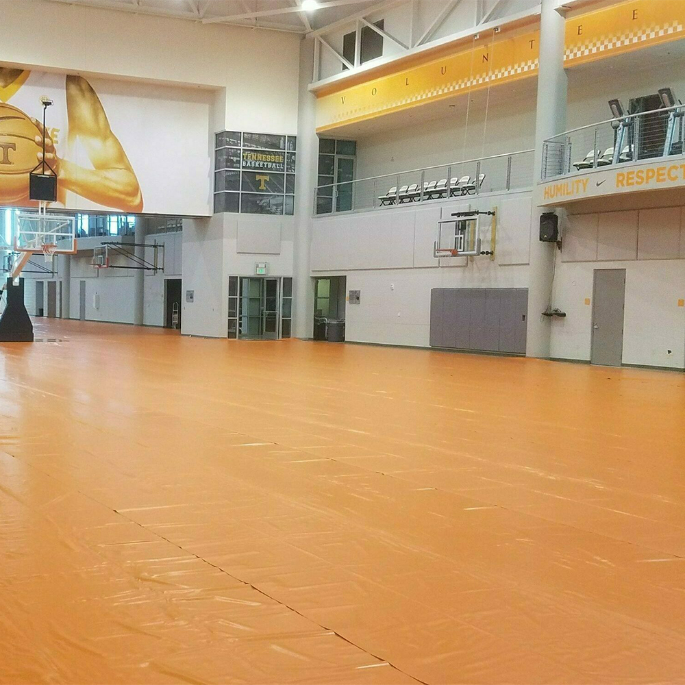 tan Gym Floor Cover 27 oz installed in empty gymnasium