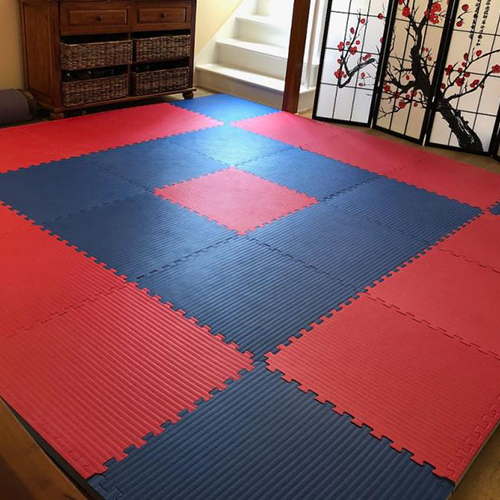 interlocking red and blue installation of bjj grappling puzzle mats