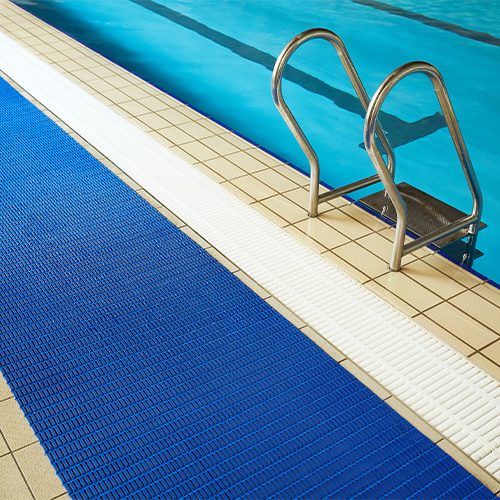 Floorline Matting in blue next to indoor pool