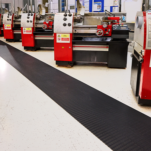 heronair matting creating a black walkway in industrial facility