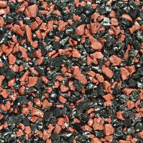 close up view of black and red playground tile
