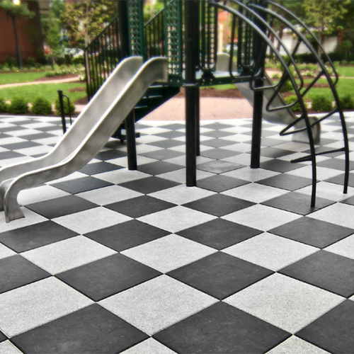 black and gray Max Playground Rubber Tiles installed under playground equipment with checkerboard pattern