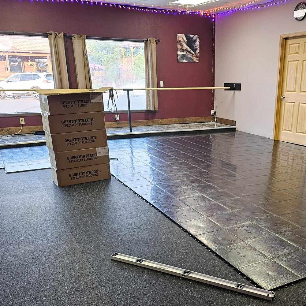 plyometric rubber flooring underlayment under dance floor tiles