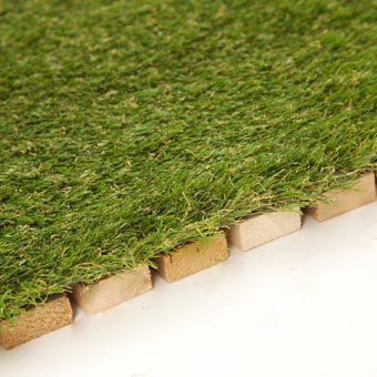 Artificial Outdoor Turf close up to grass and wood
