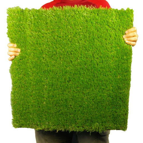 Holding Outdoor Deck Turf Tile.