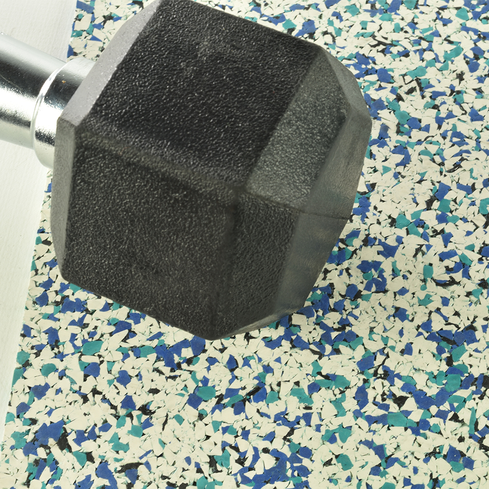 close up of nuclear rubber flooring tiles ocean view color with dumbbell on top
