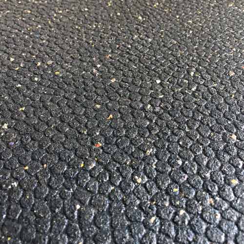 close up of rubber horse interlocking stall mats pebble texture