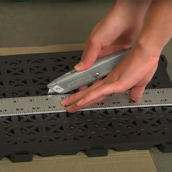 cutting interlocking deck tiles
