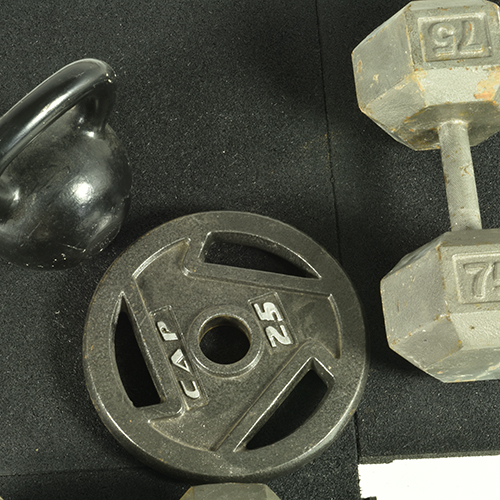 Weights on Sterling rubber gym tiles 1.25 Inch Black
