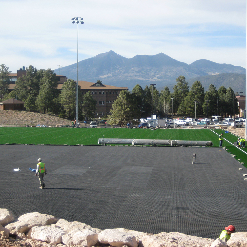 installation of turf drainage tiles for sports field