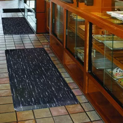 black marble look fatigue mat in bakery on stone floor