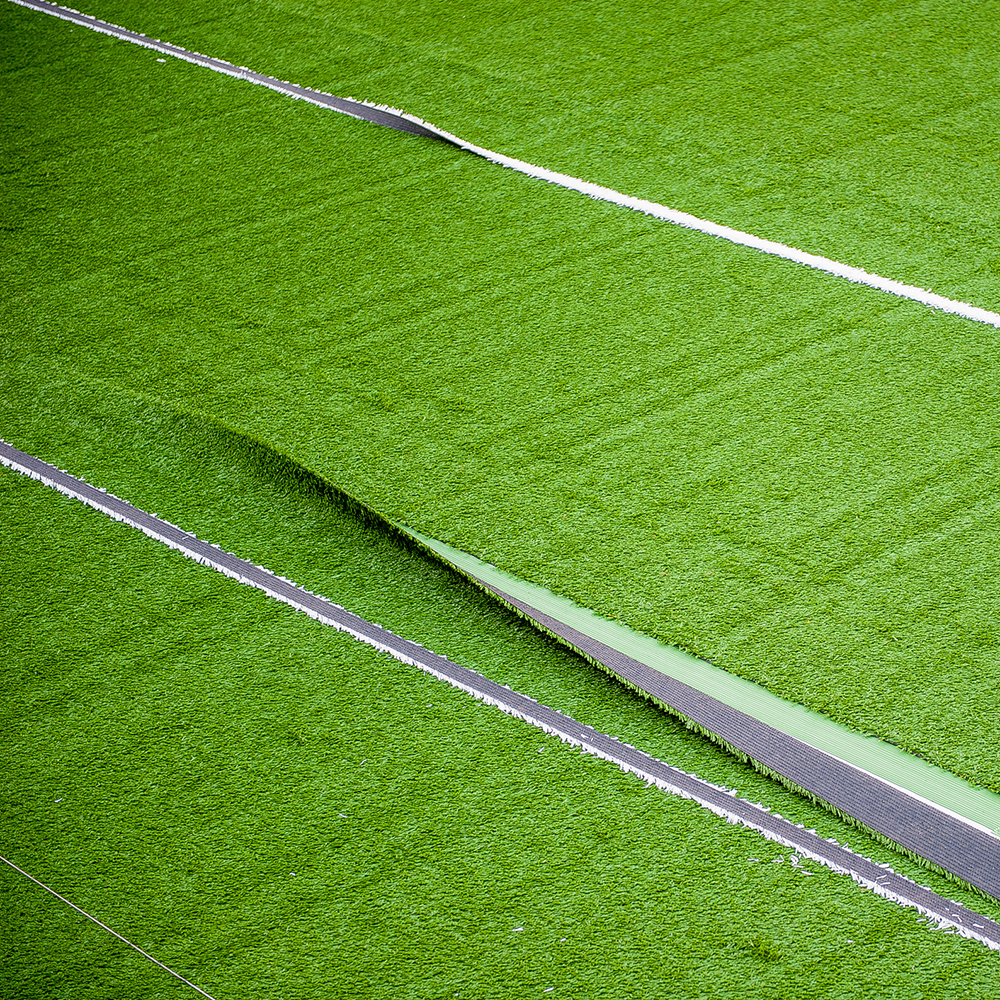 artificial turf rolled out with seams showing