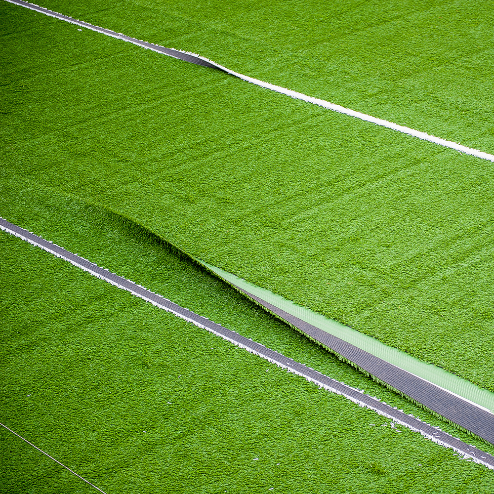 artificial turf rolled out with seams showing