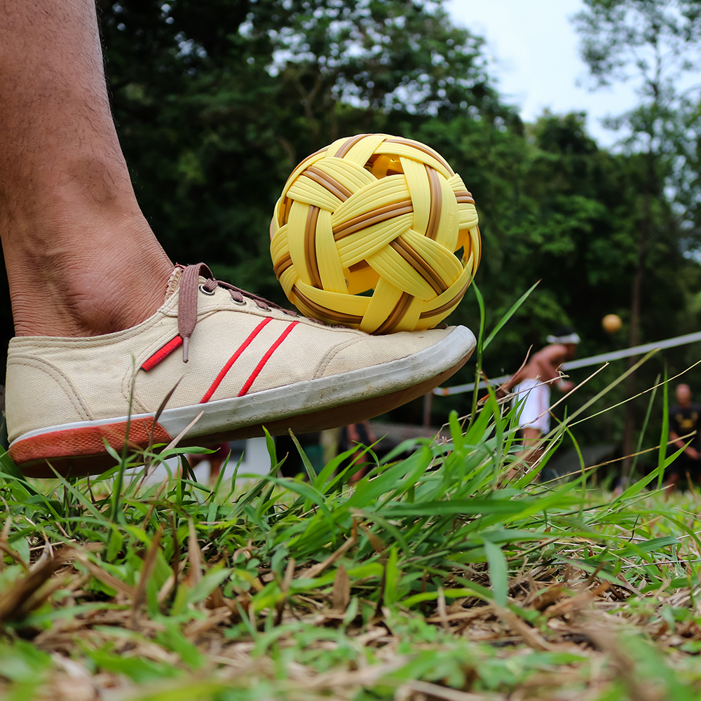 playing Sepak Takraw or kick volleyball