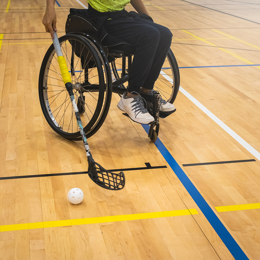 playing floorball in a wheelchair