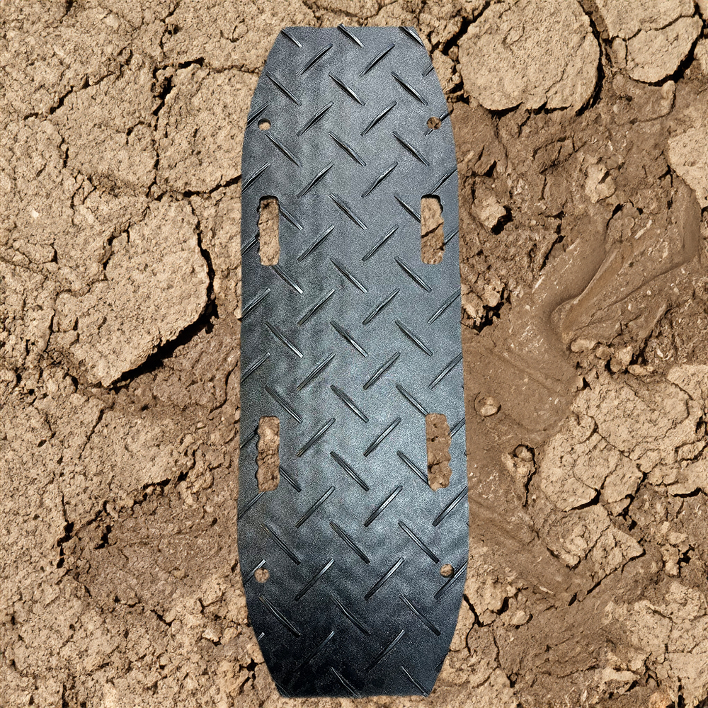 Blue Gator Recovery Traction Diamond Mat Black 1/2 Inch x 1.4x4 Ft. close up with mud