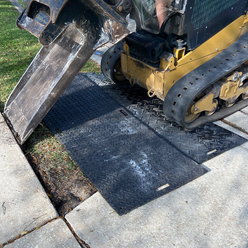 Sidewalk removal with Ground Protection Mats 4x8 Ft protecting lawn