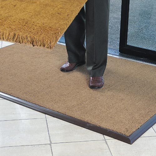 The attractive Cocoa Brush entrance mat with vinyl backing provides excellent scraping action.