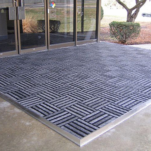 entrance tile is plastic and carpet with holes 