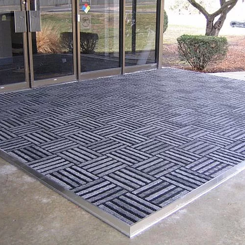 Entrance Tile 1/2 inch Black w/Charcoal Carpet exterior view.