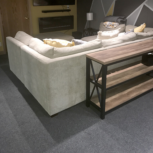 cozy family media space in basement with interlocking carpet tile flooring