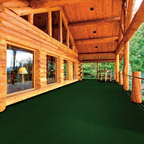 grizzly grass carpet tiles on log cabin patio
