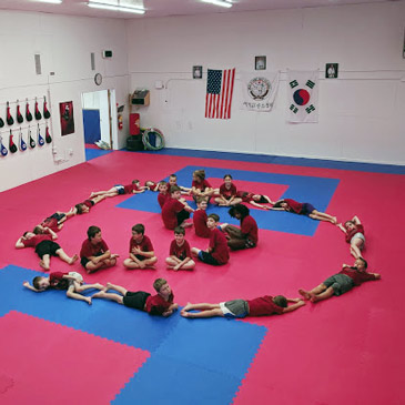 martial arts studio with foam floor puzzle mats in red and blue
