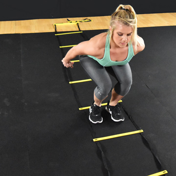 agility ladder jumps on plyometric rubber