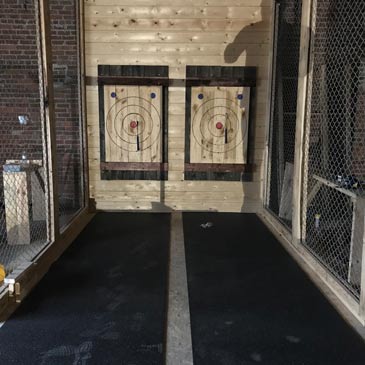 Axe throwing lanes with rubber flooring