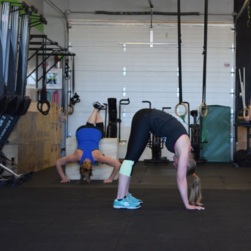 CrossFit Duluth downward dog on Sound Reducing Crossfit Mats