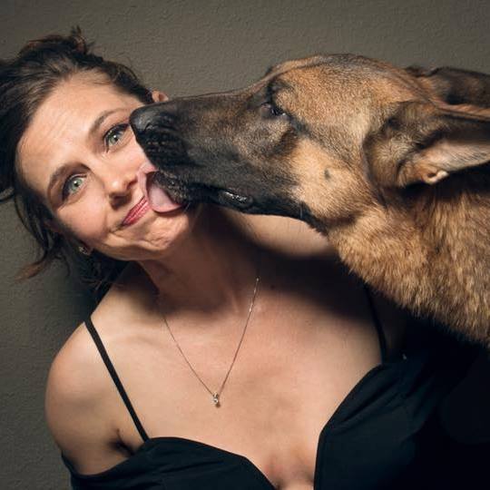 Windy Pool with German Shepard licking her face