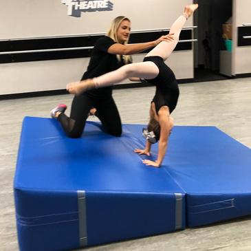dance instructor using cheese mat for teaching